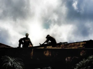 2 constructors on a roof top 